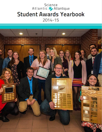 Science Atlantic's student awards yearbook cover for the year of 2014-2015. At the top there's a banner for Science Atlantic. Below there's the title of the yearbook. Below the title, there's a group picture of individuals smiling. Some individuals are standing and some are knelling down. One individual is holding a certificate and three are holding plaques.